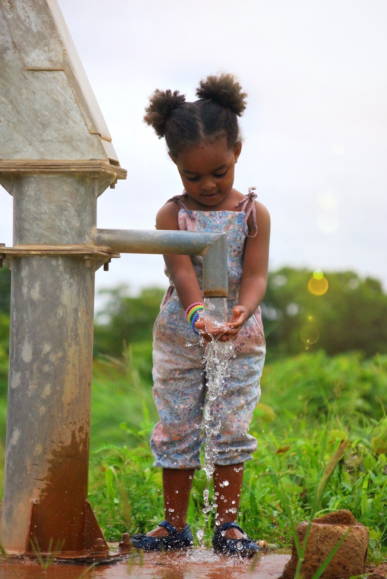 girl-washing-her-hands-at-a-water-well-in-burkina-faso-africa.jpg